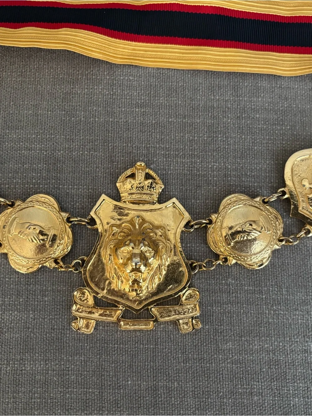 Gold Tone Lion Medallion Ceremonial Belt with Red, Black and Gold Ribbon